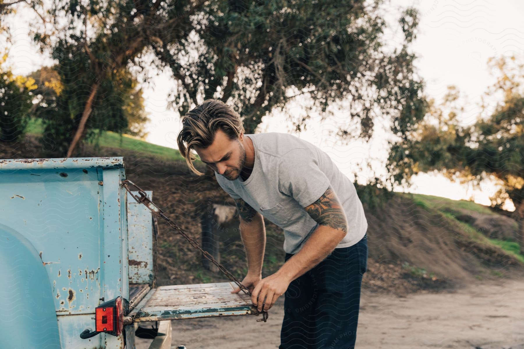 Stock photo of a determined adult male worker with one hand visible