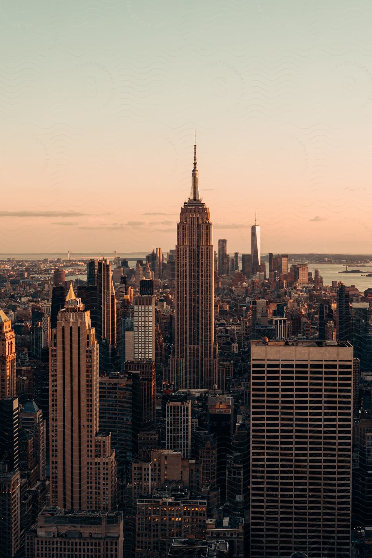 Skyscrapers rise over a city at dawn in new york city