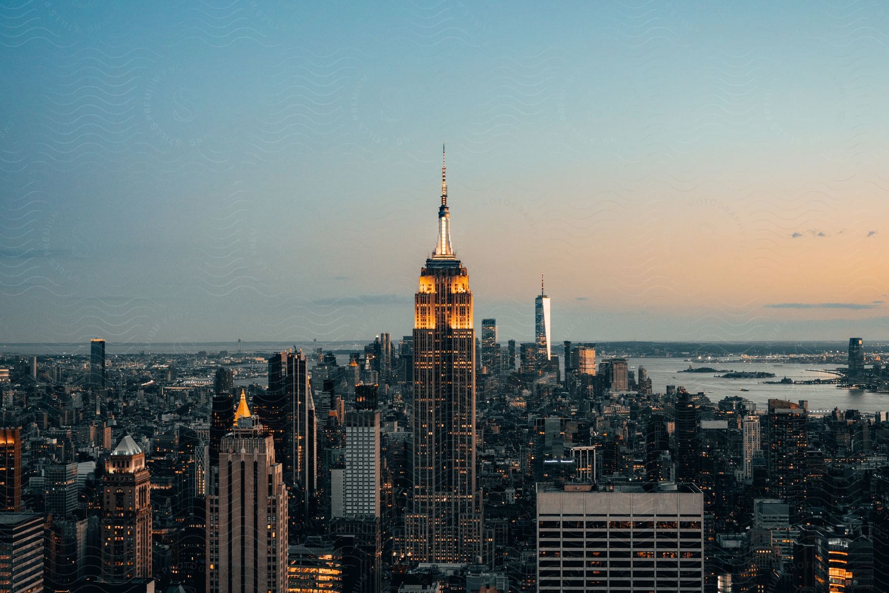 Empire state building at a clear sunrise in new york city