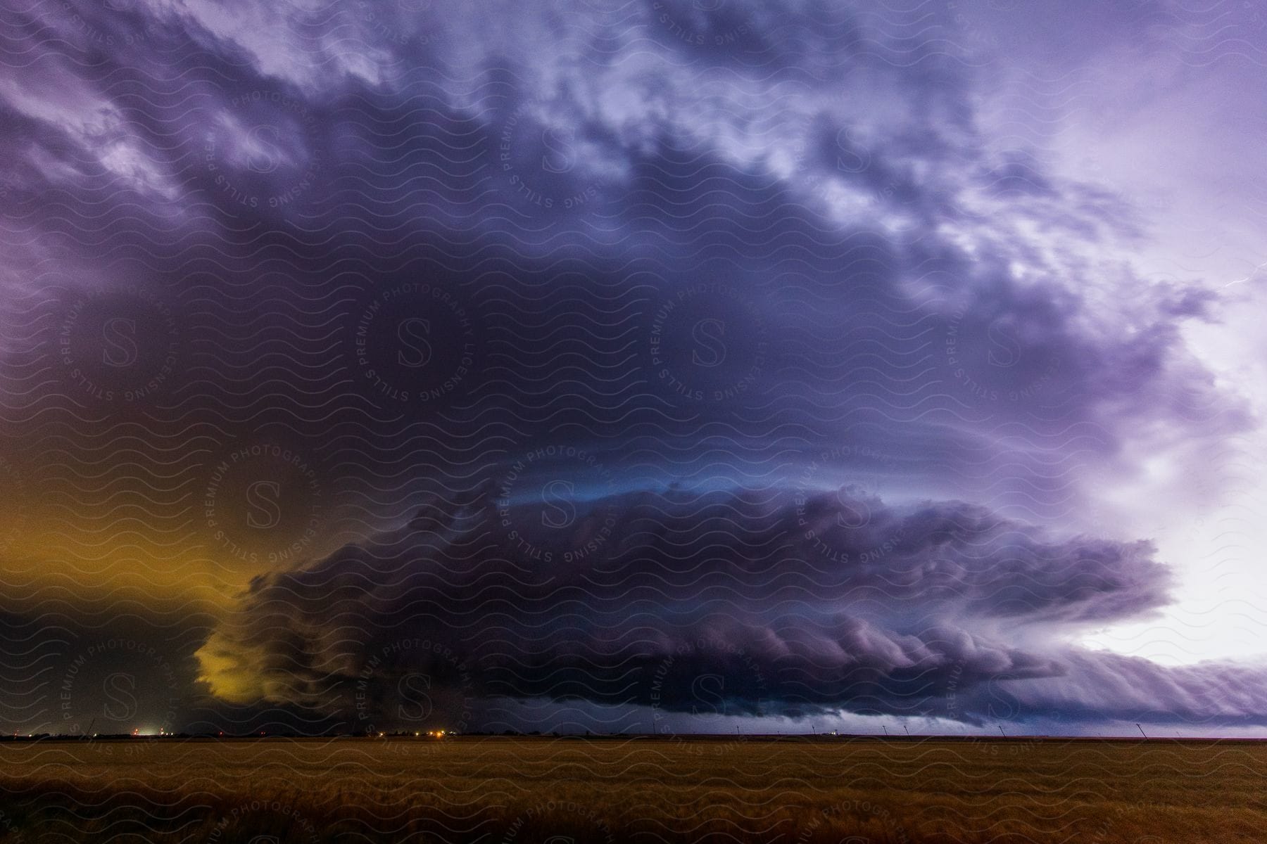 A massive storm moves towards dodge city kansas at night