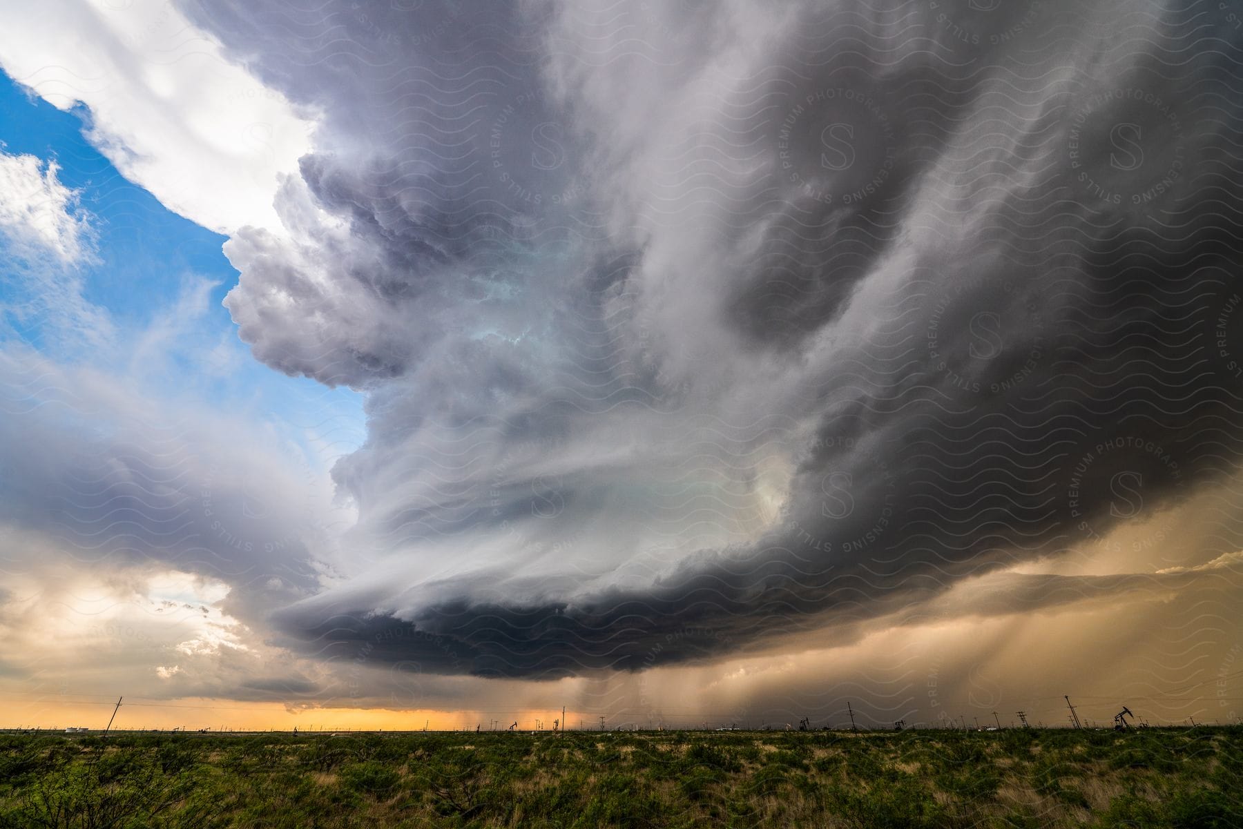 A stormy sky with dark clouds obscuring the blue sky