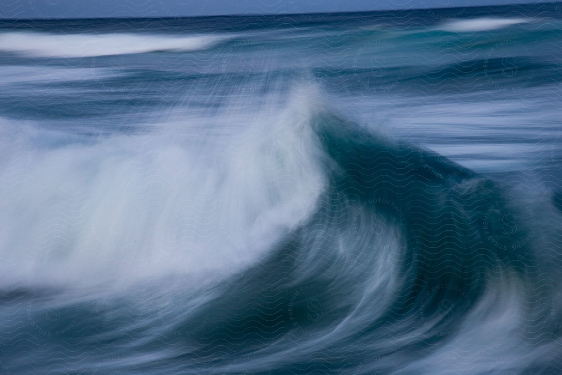 Ocean waves moving across the surface of water