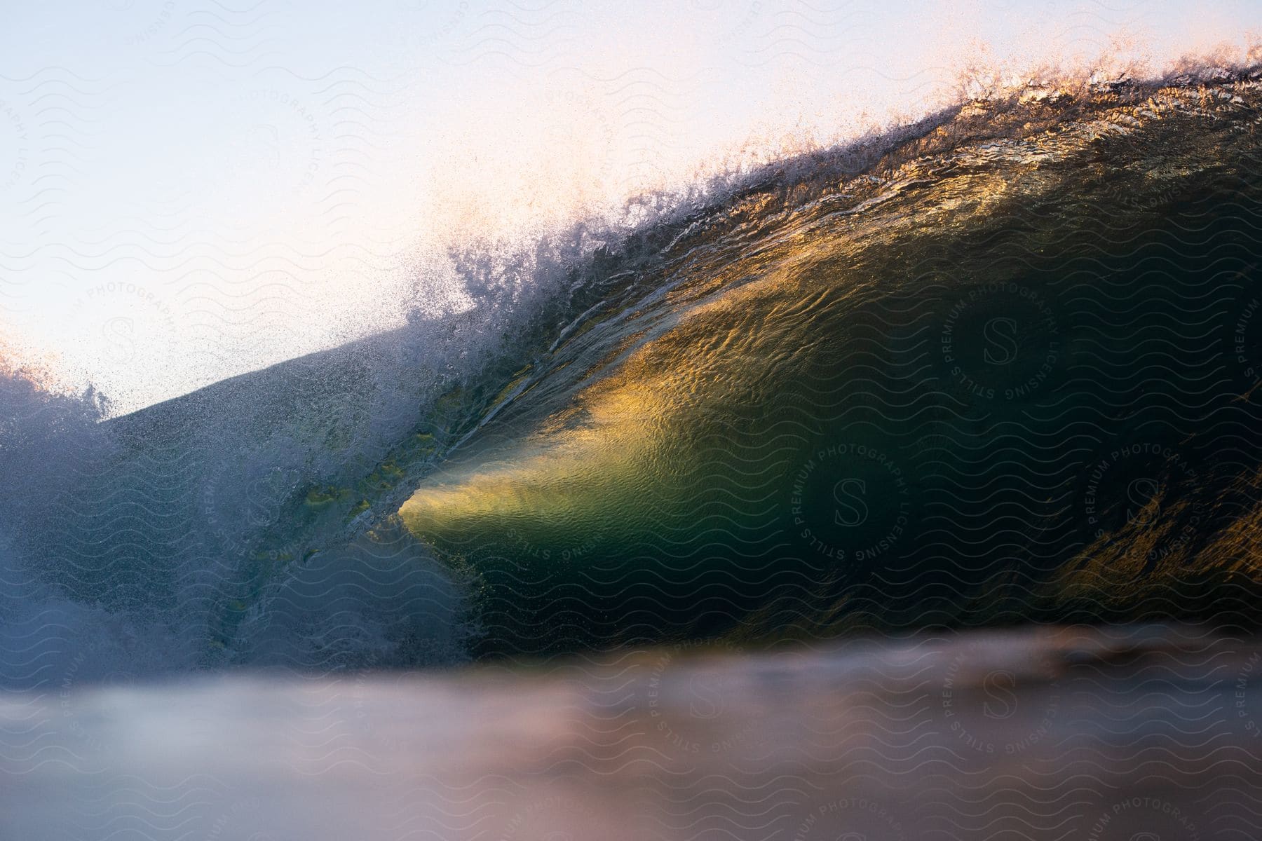 Golden hour waves crashing against the shore