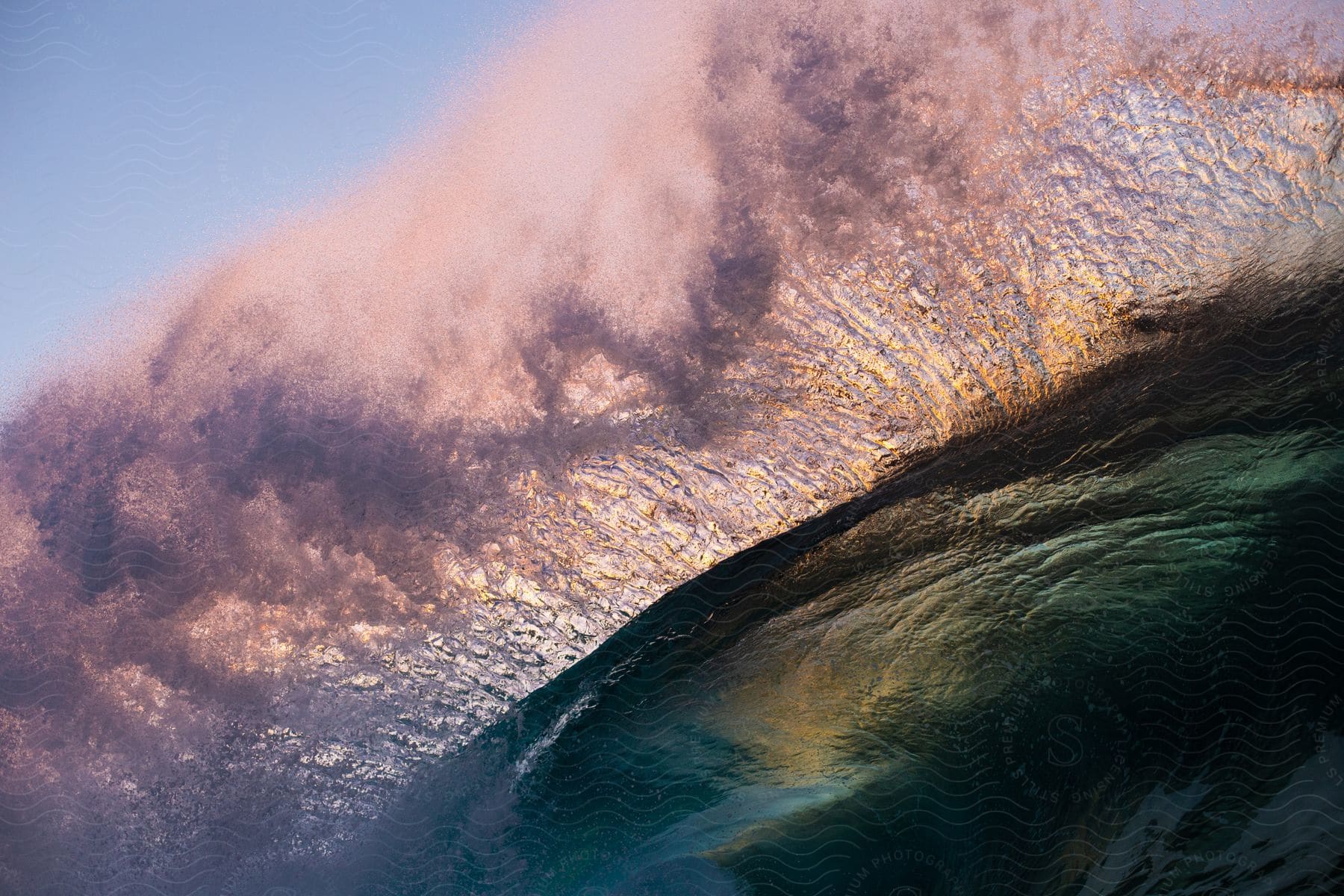 Golden hour waves crashing against the shore