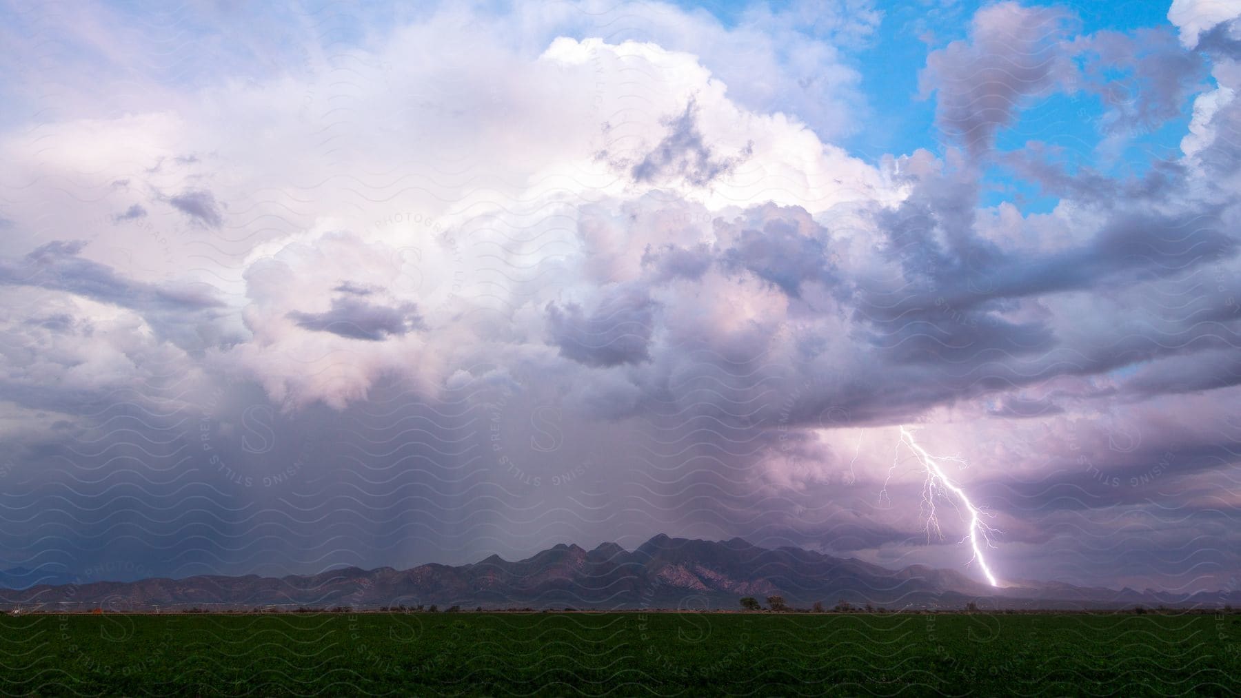 A powerful thunderstorm with lightning over the chiricahua mountains at sunset