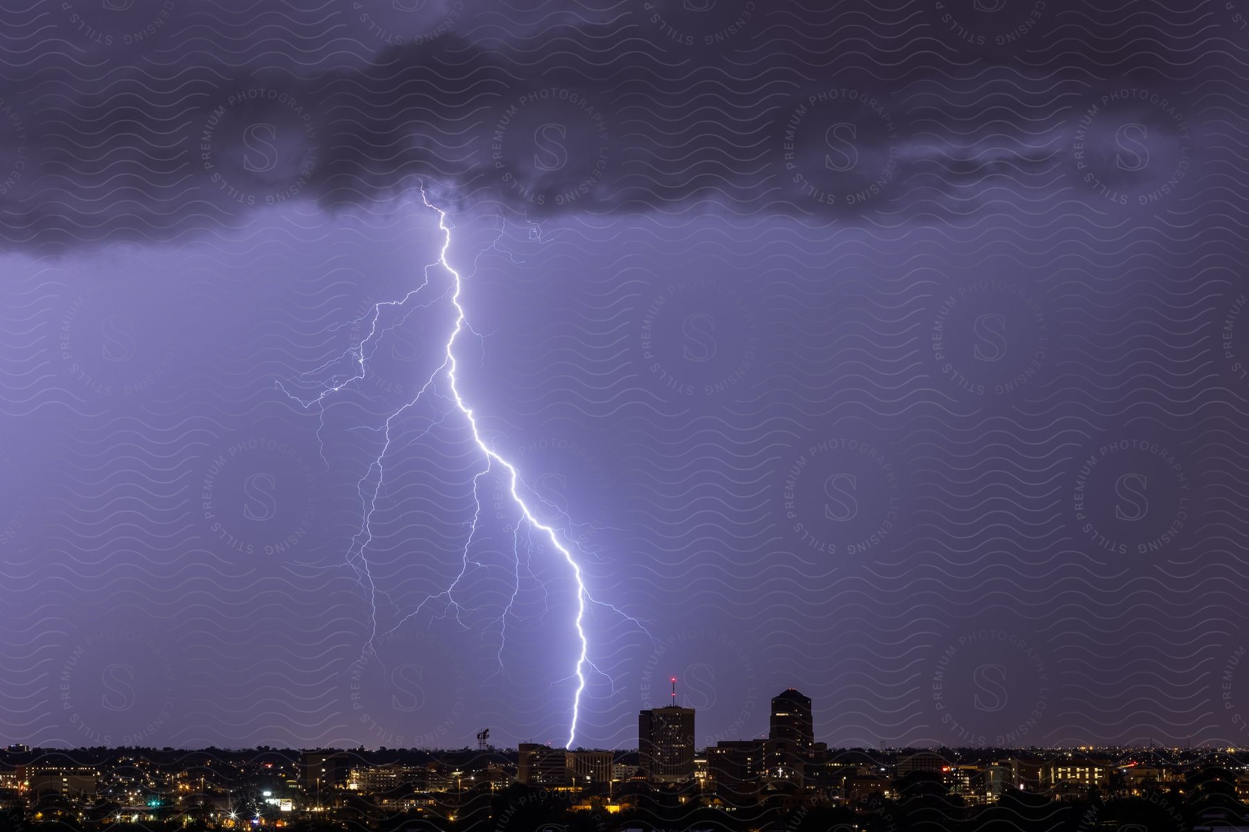 City engulfed by storm lightning streaks across dark clouds creating thrilling spectacle