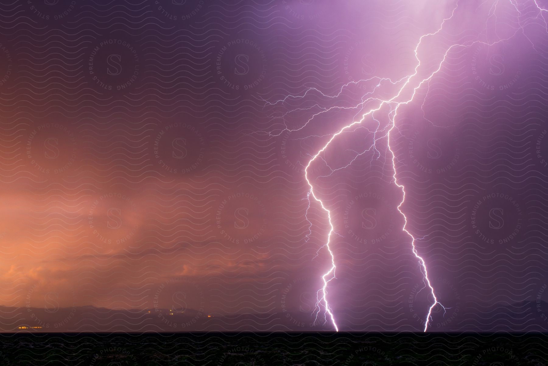 Landscape with lightning in the background colors of the sky preparing for a storm