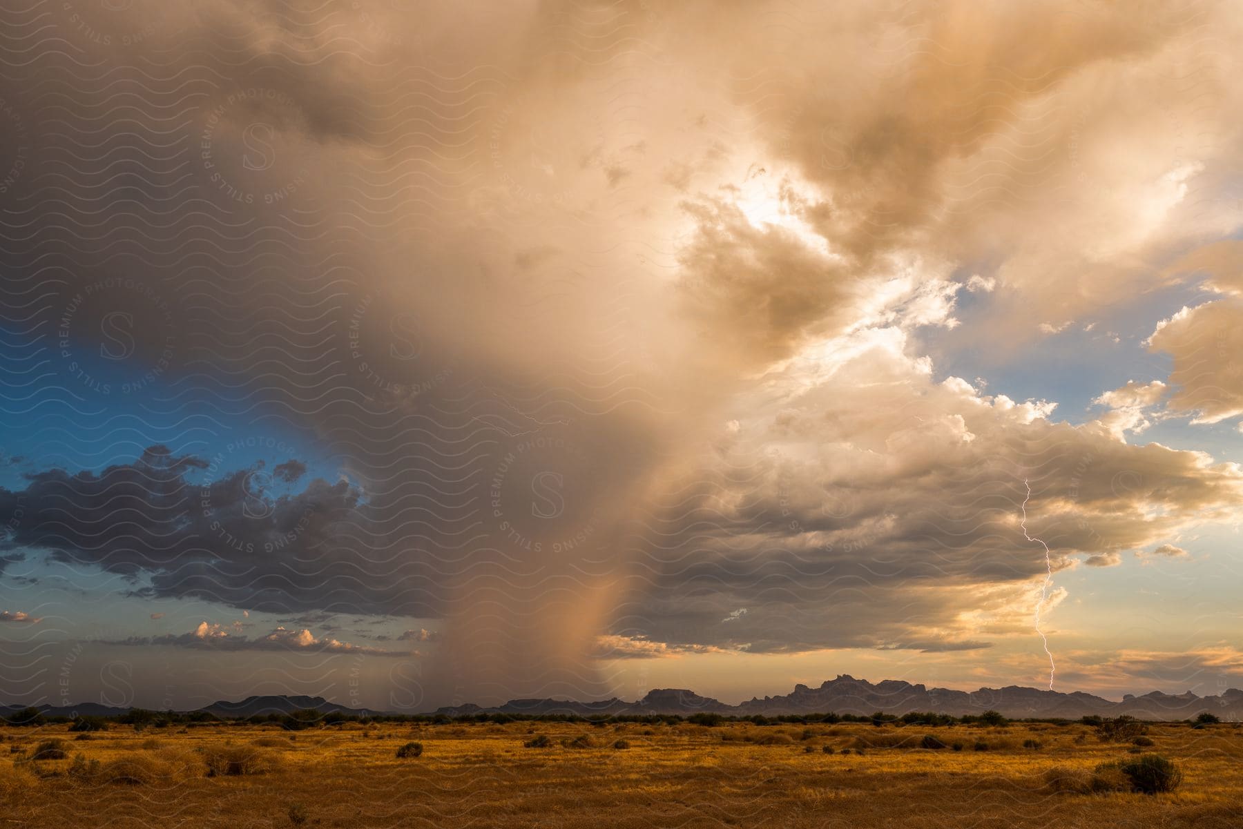 A tornado touches down in a storm on the horizon in the eagletail mountains west of tonopah az
