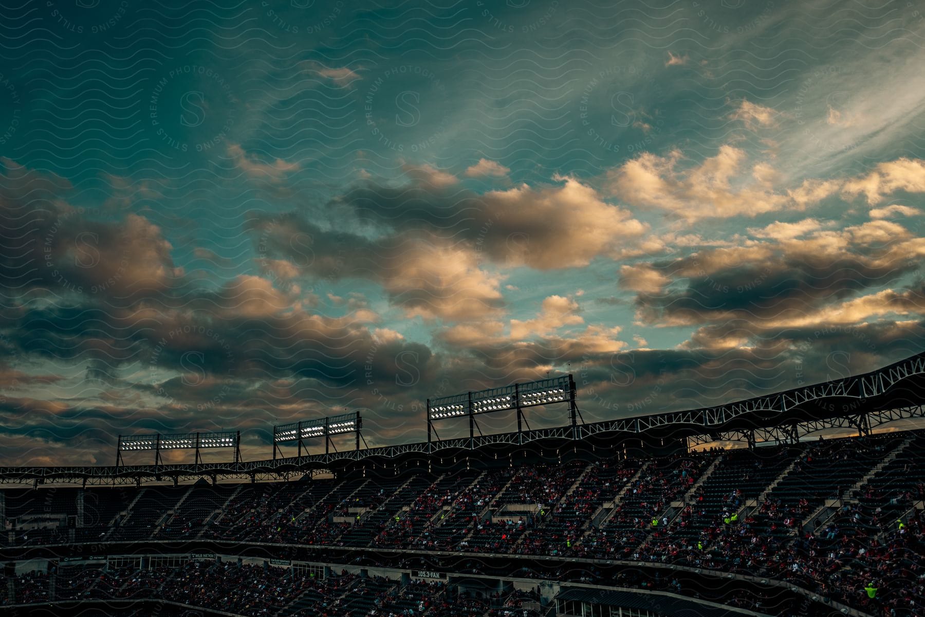 Stadium tribune with fans watching a match