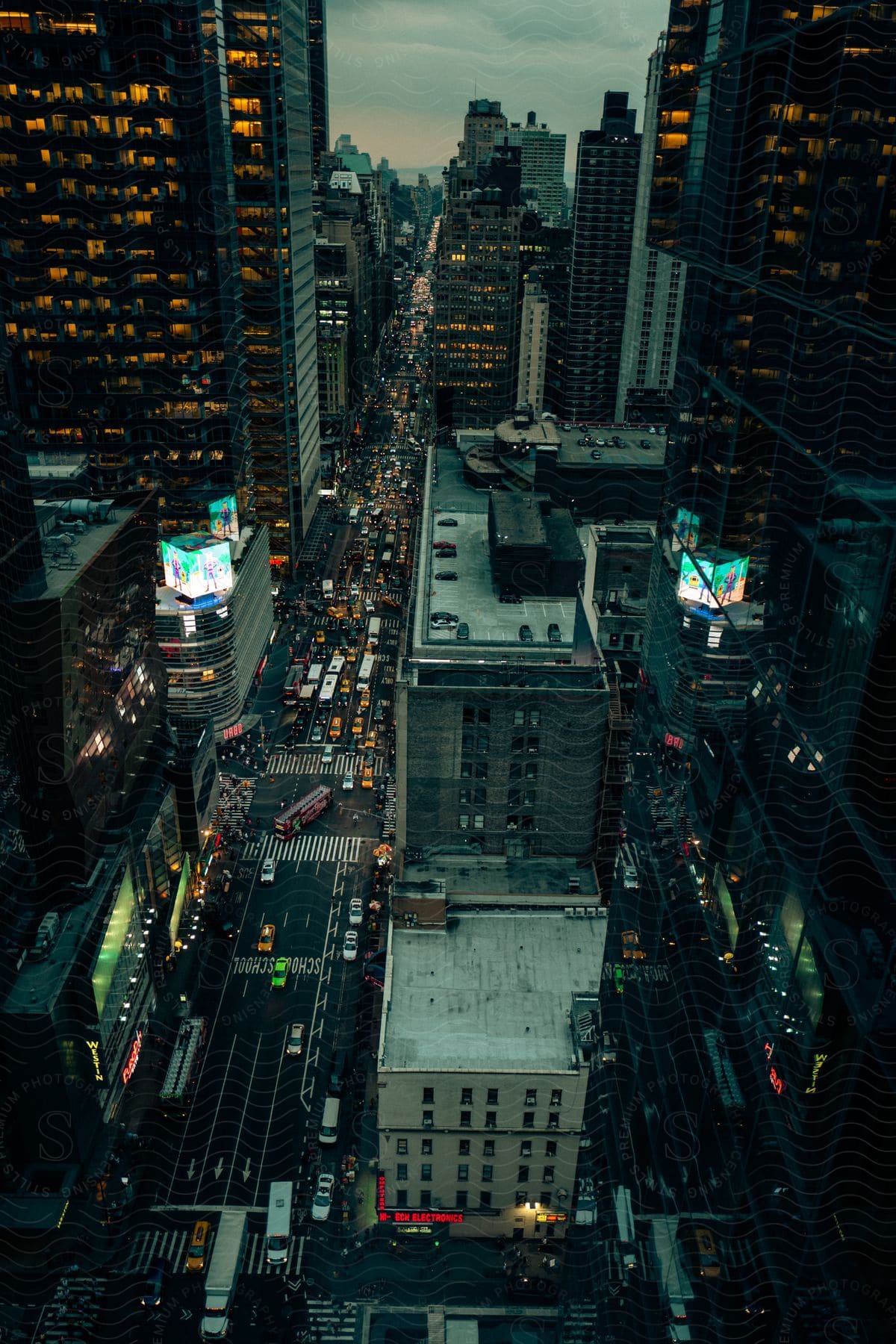 A city with towering skyscrapers and a busy road in the daytime