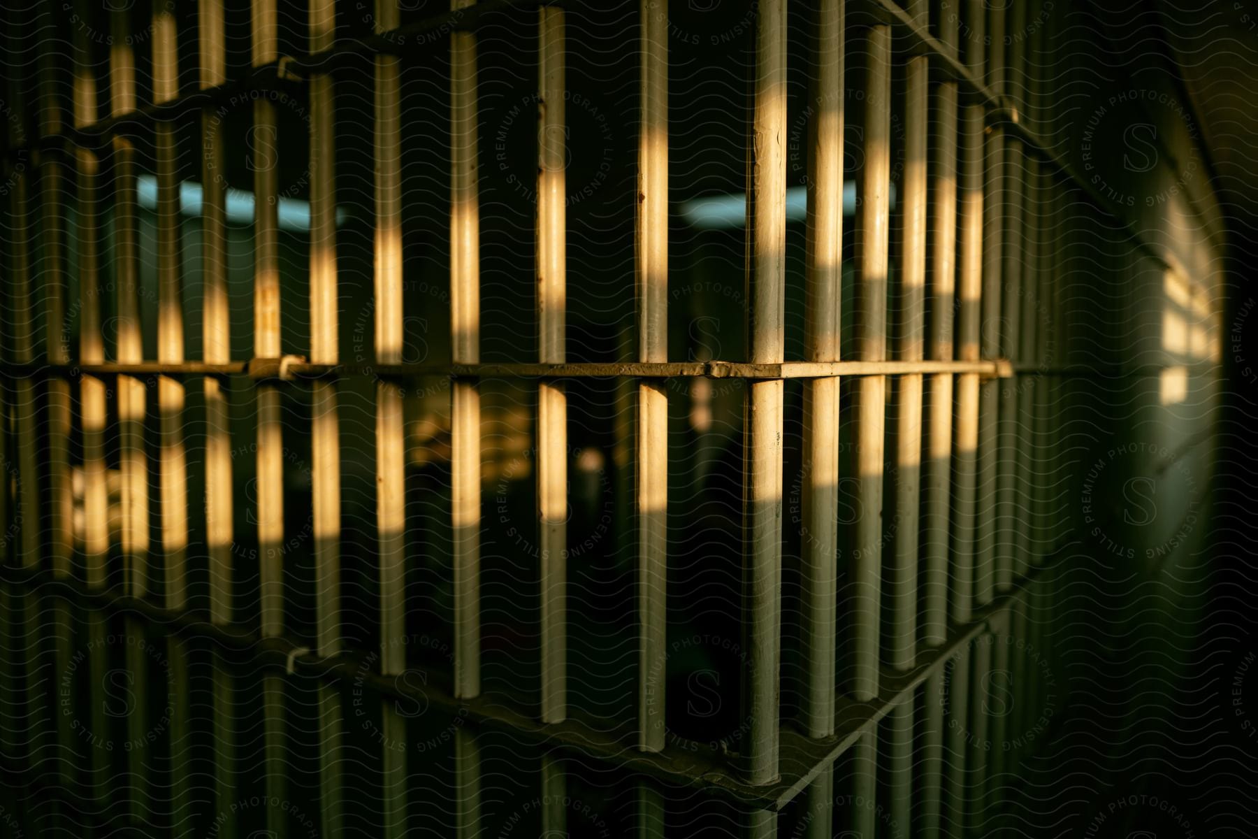 Jail cell bars in shadow an image of prison architecture