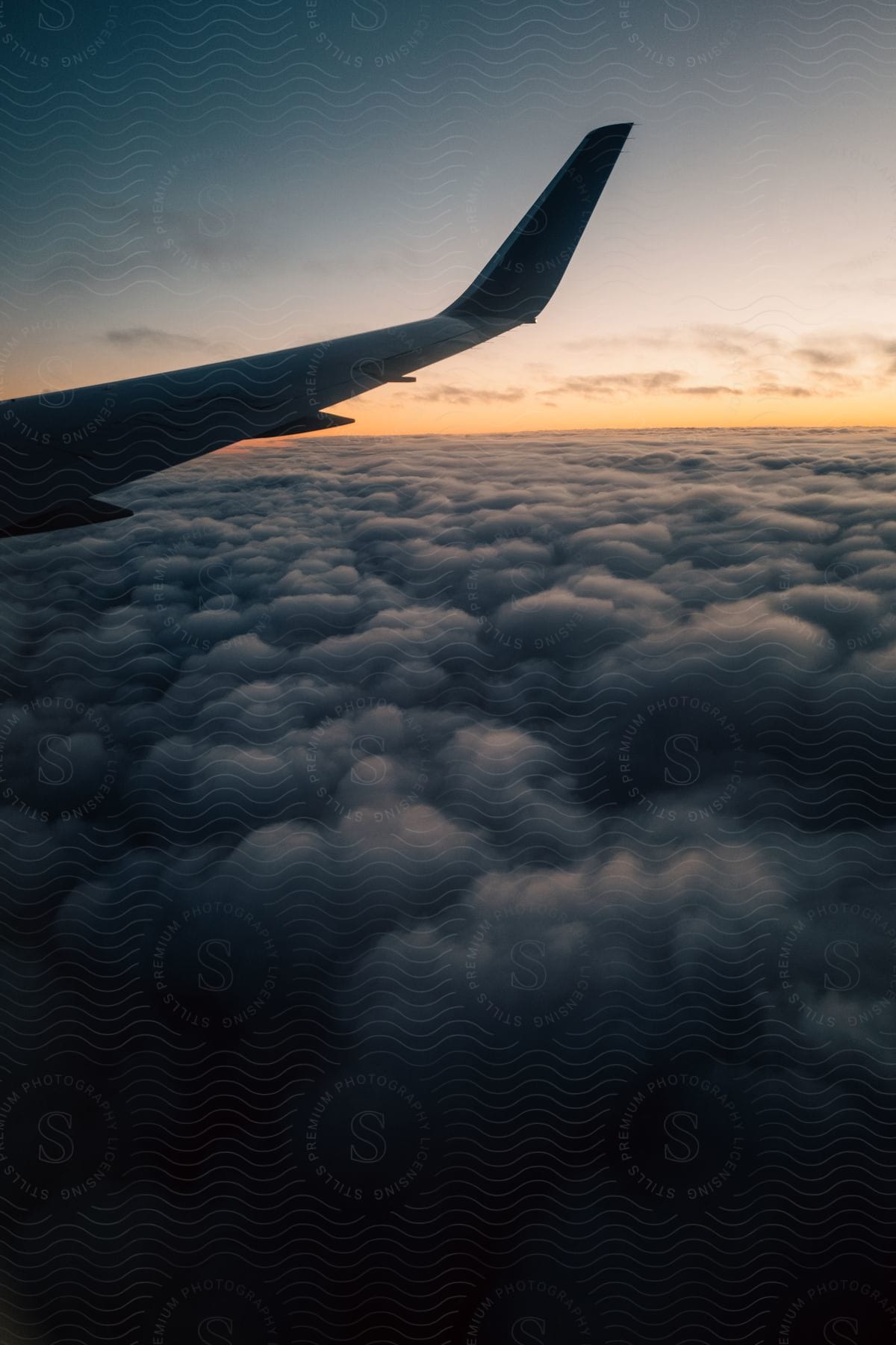 A Sunset Sky With An Airplane Wing