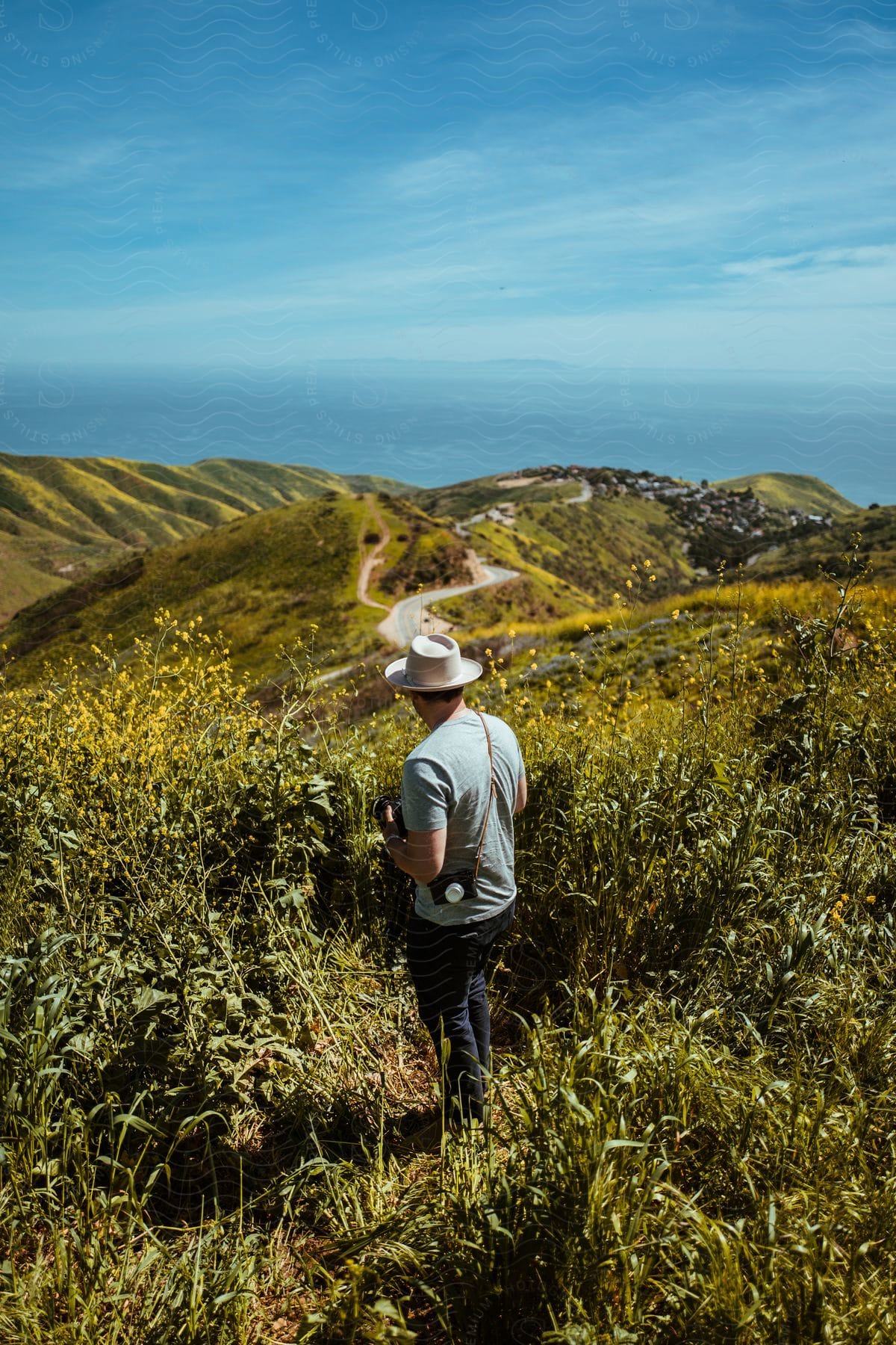 A man hiking through the wilderness during the day time