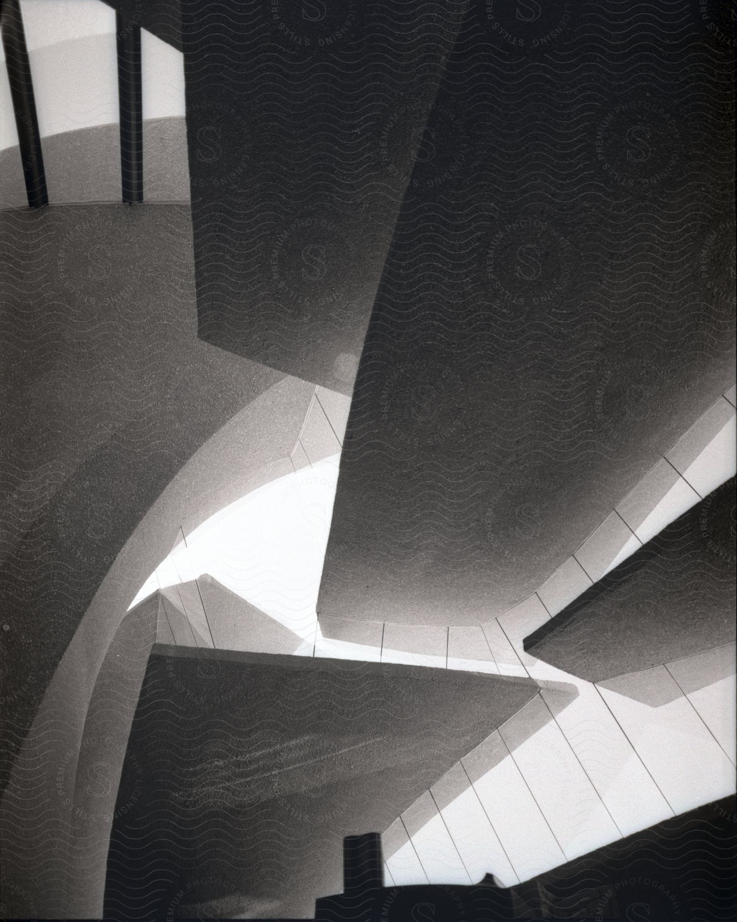 Black and white photo of an interior space with a staircase