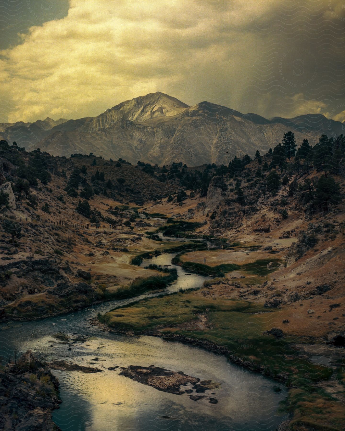 Stock photo of aerial perspective of a river leading up to a mountain