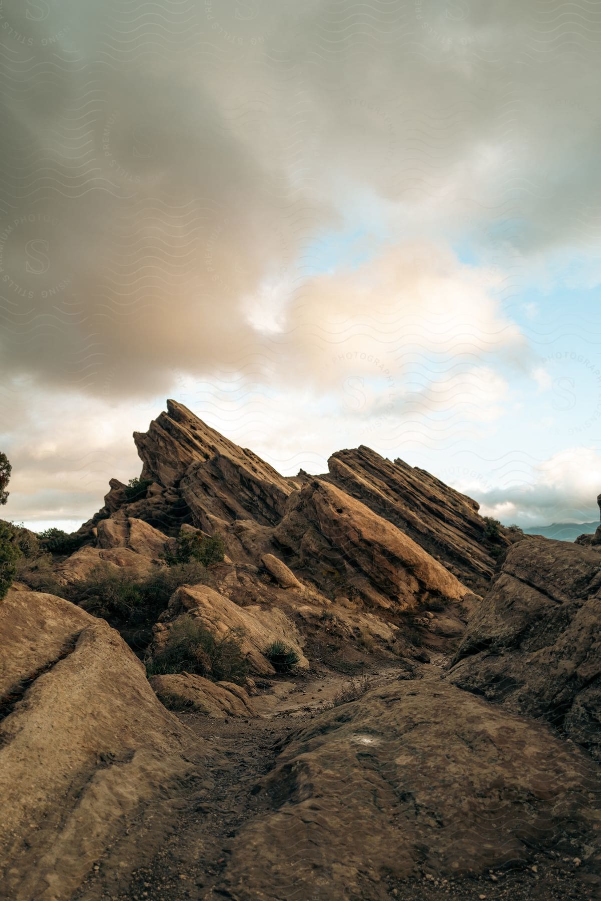 Rock formations on a mountain in a cloudy sky
