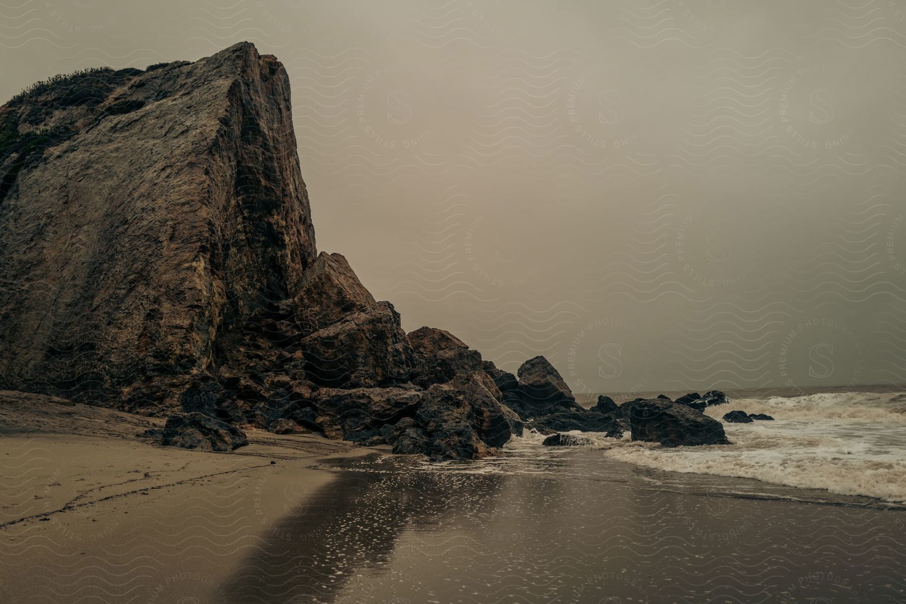 Beach And Ocean Near A Mountain