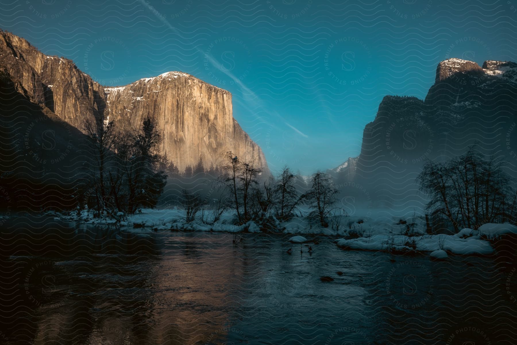 An icy lake with mountains in the background