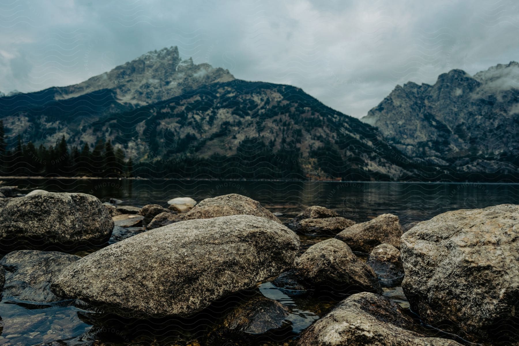 A serene landscape with a lake mountains and vegetation