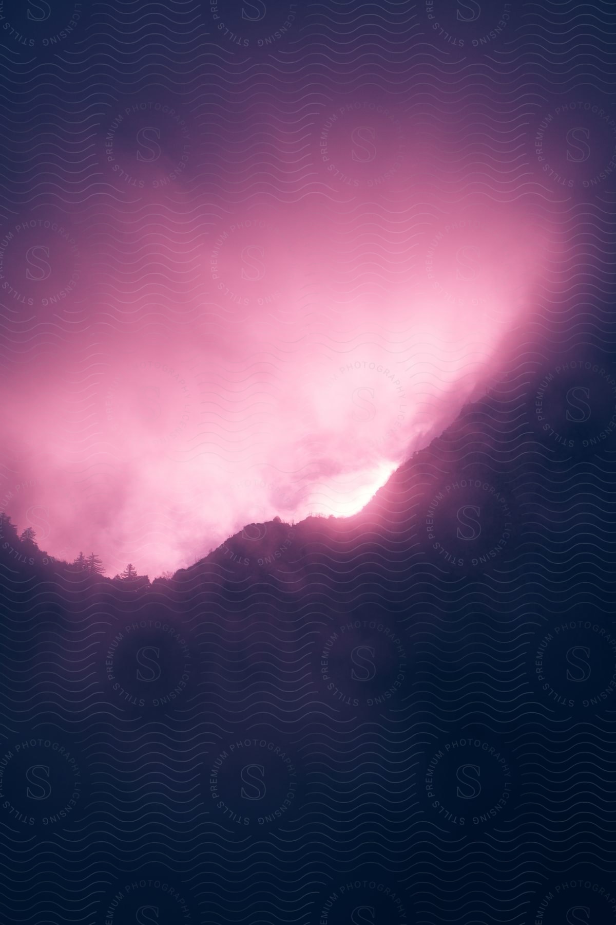 A colorful sky at dawn with a violet and pink atmosphere