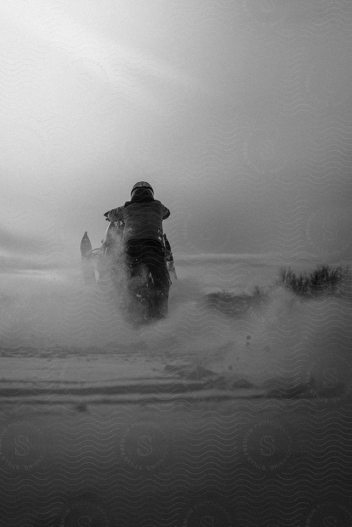 Flat winter landscape with a person in a motor vehicle in the north woods of wisconsin