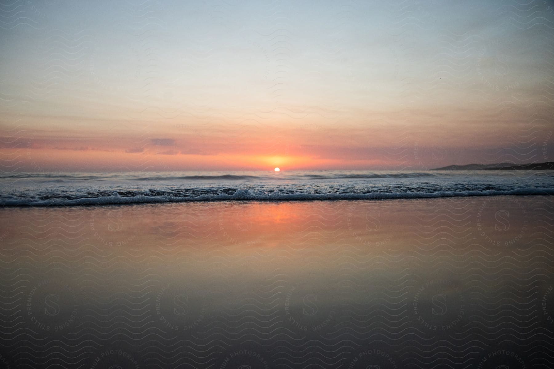 A hazy sunset over the ocean