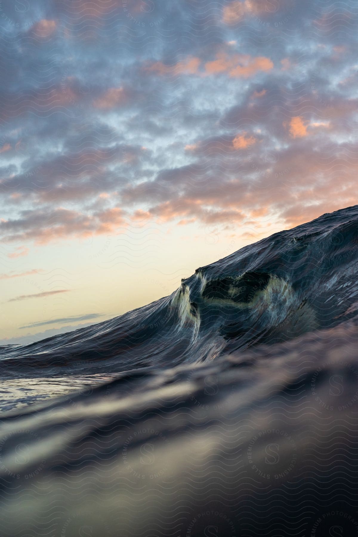 Close up of ocean waves at dusk showcasing shapes and textures