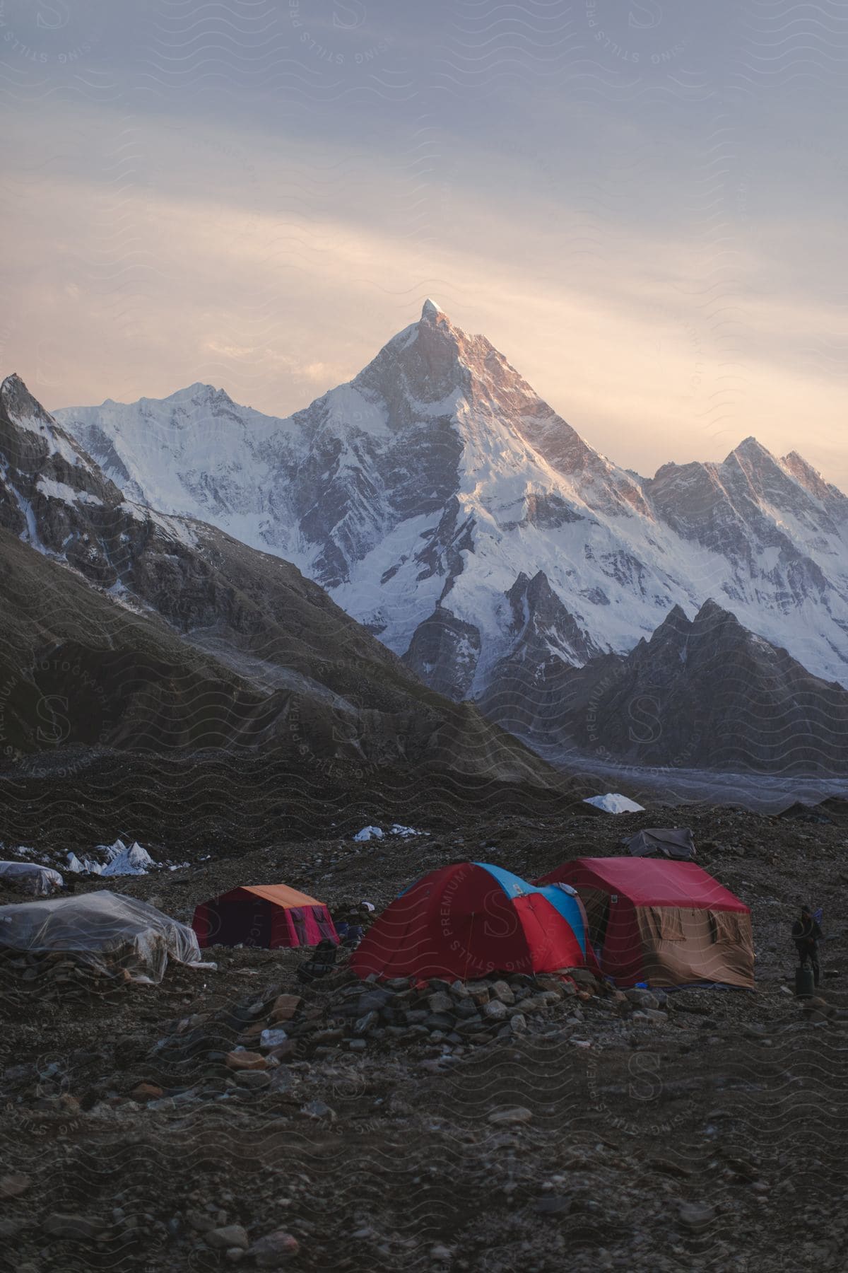 A campsite near snowy mountains in the karakoram mountain range in pakistan
