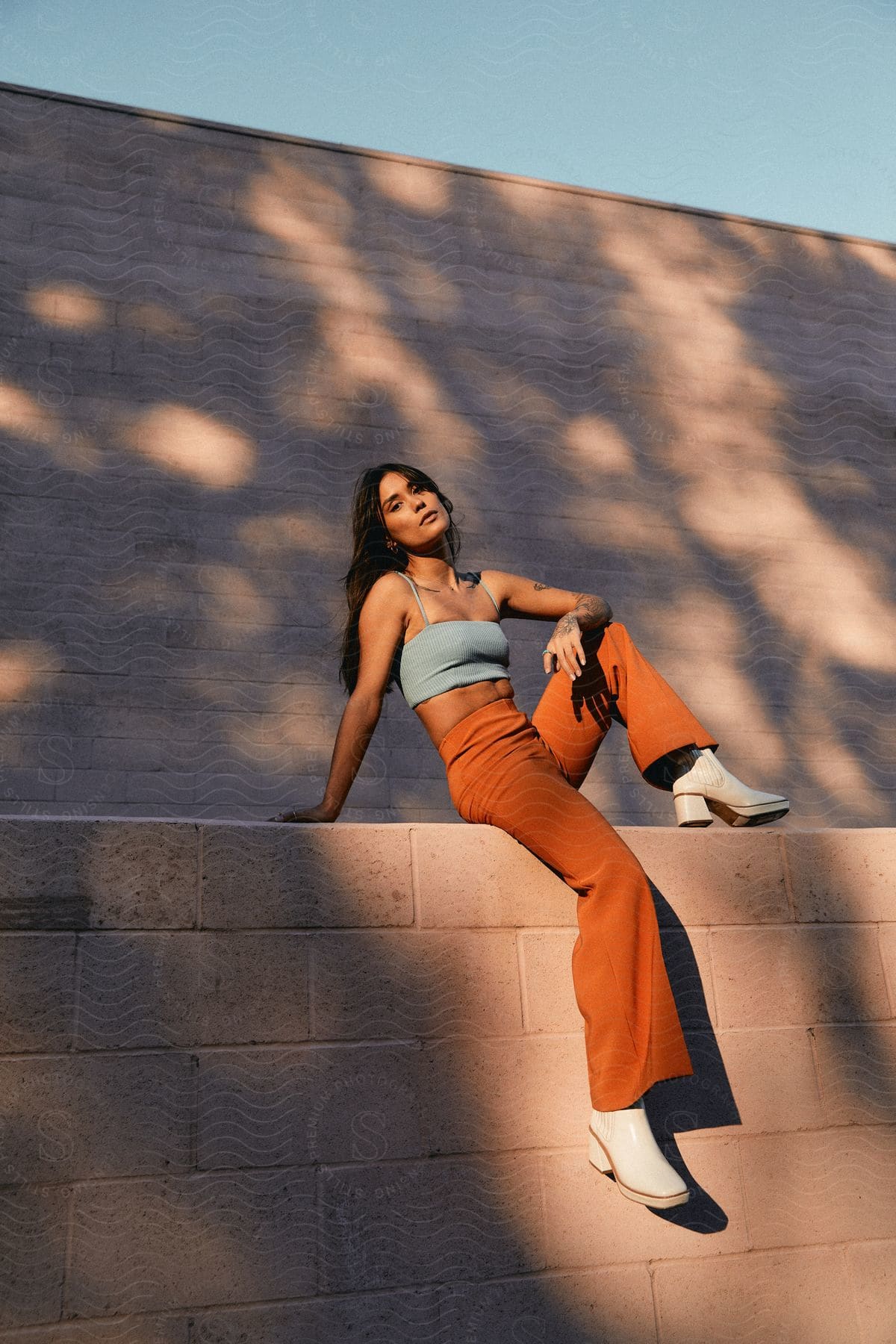 Darkhaired woman posing outdoors with vintage fashion outfit