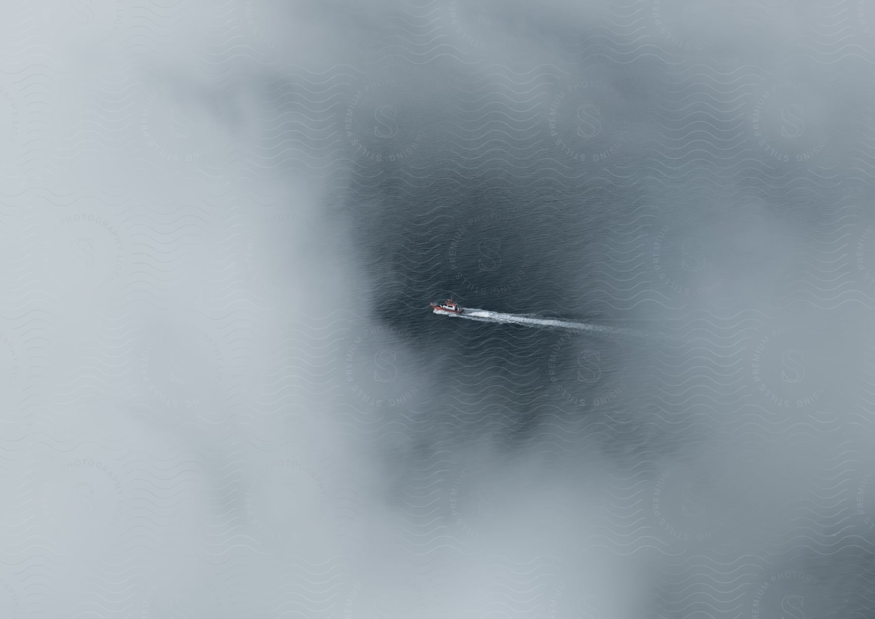 A boat sailing through clouds in the sky