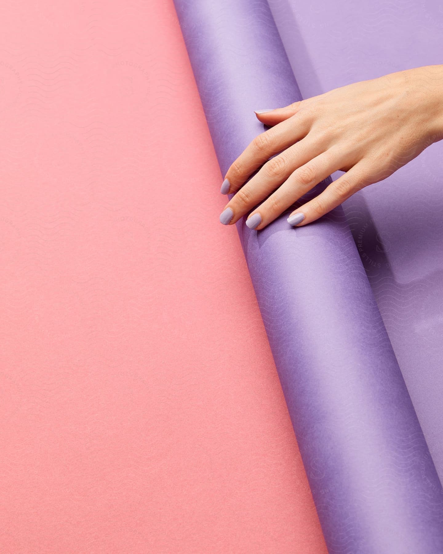 Closeup of a person with purple nail polish