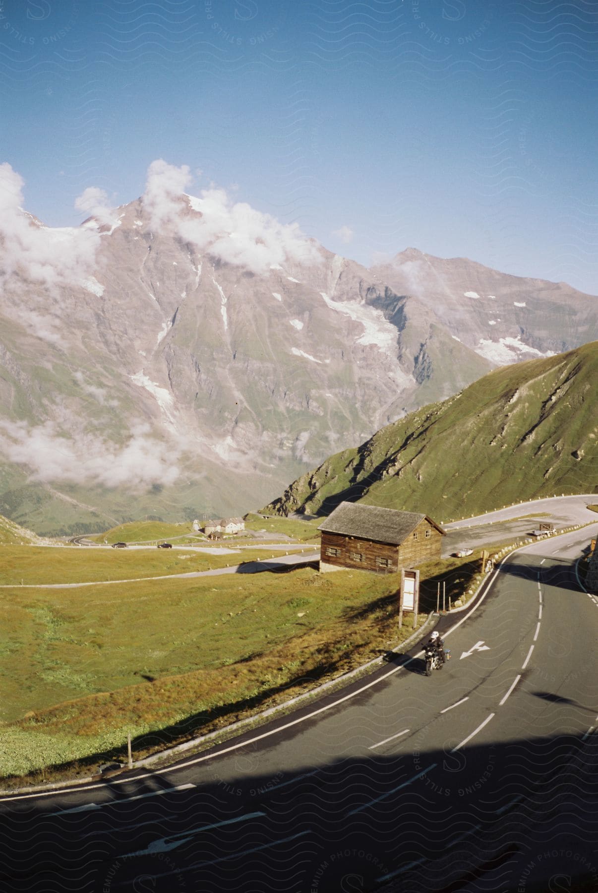 A solitary person on a mountain road in a rural countryside