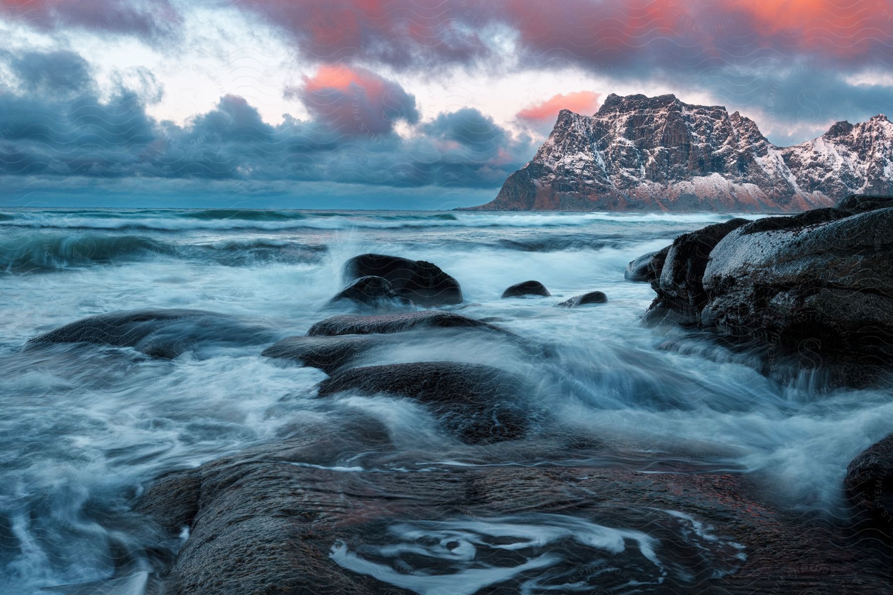 Sunset over oceanic landform in lofoten norway