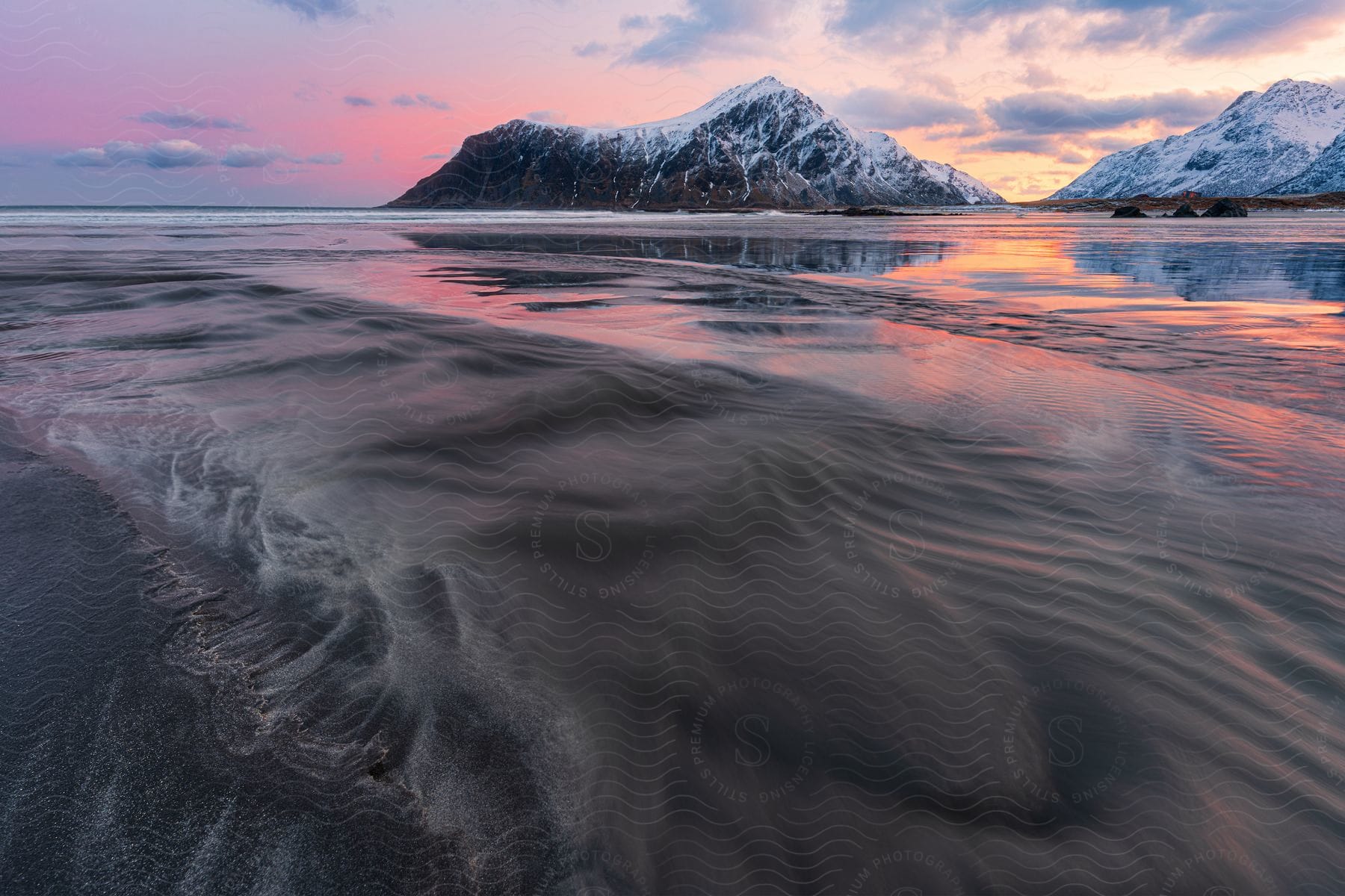 Coastal landscape with ice mountains on the horizon