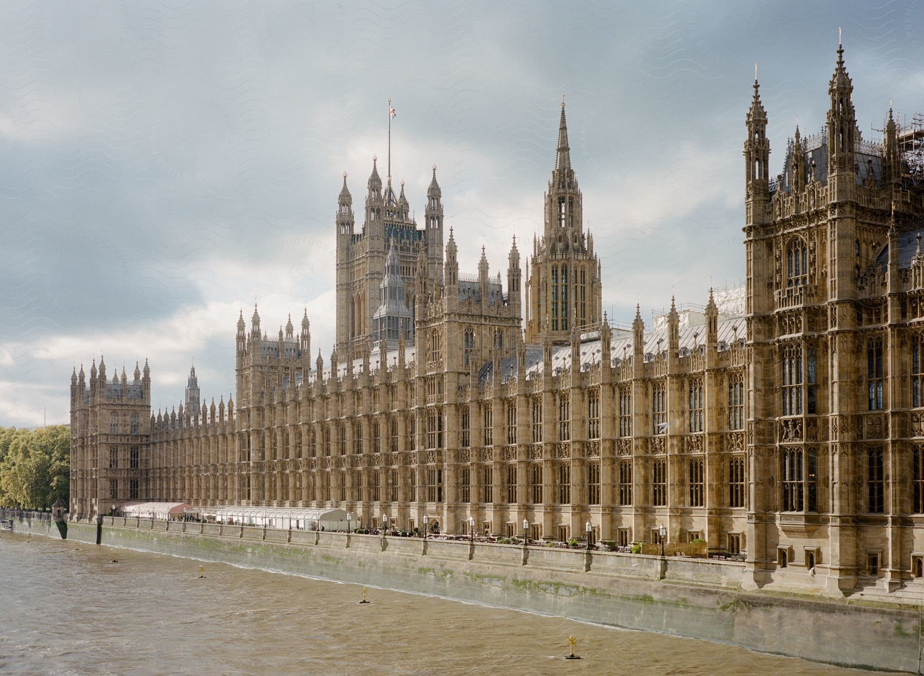 Architectural Building With Tall Steeples And Columns Next To A Waterway