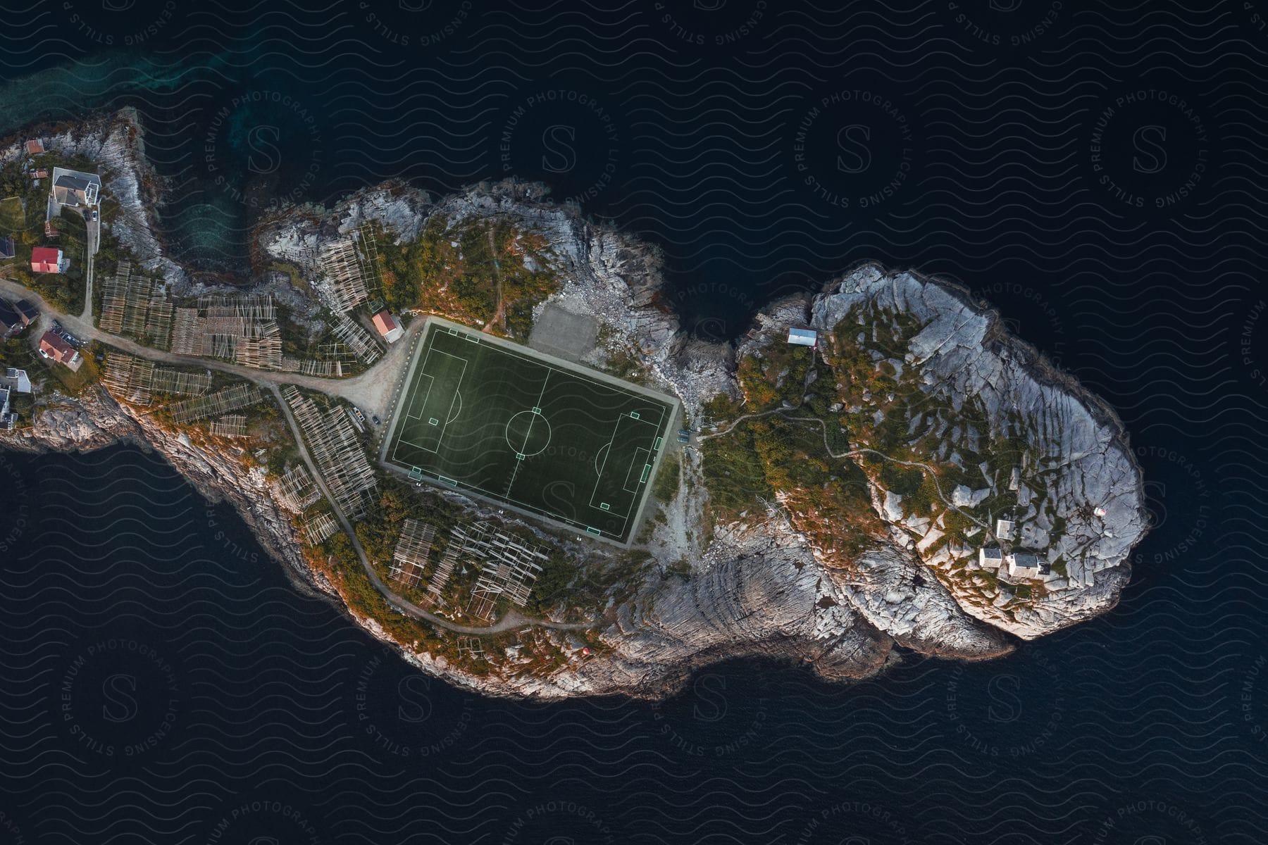 A soccer field on an island surrounded by calm water