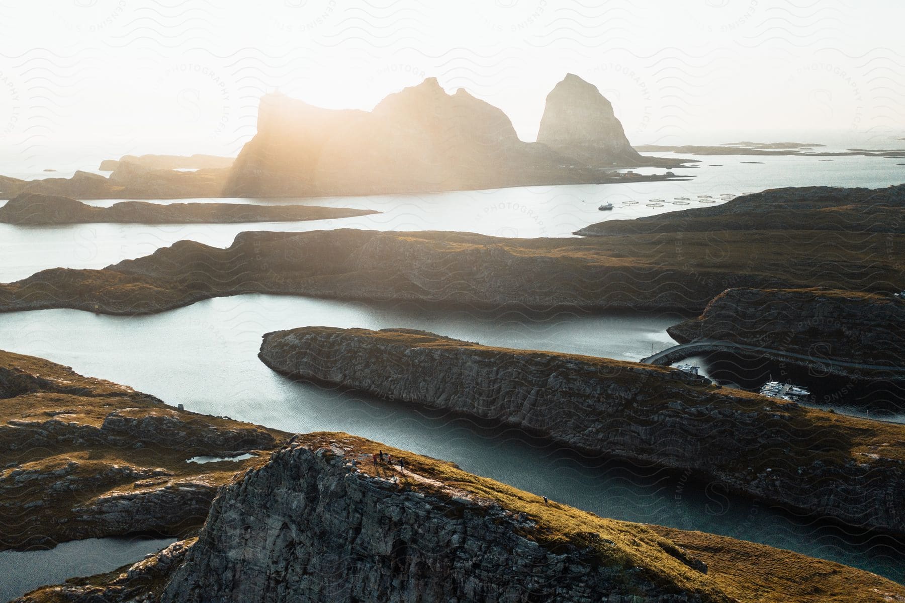 A serene view of a lake surrounded by nature and rocky terrain