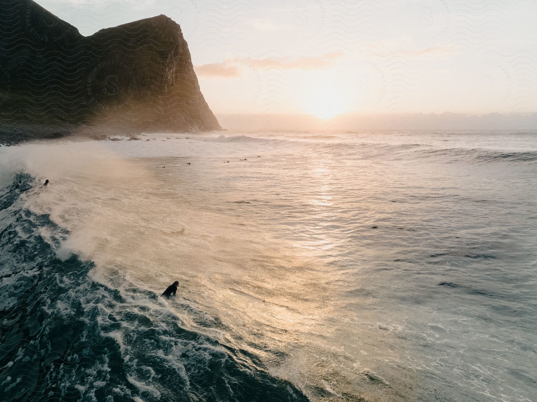 A Person Swimming In The Ocean During The Day