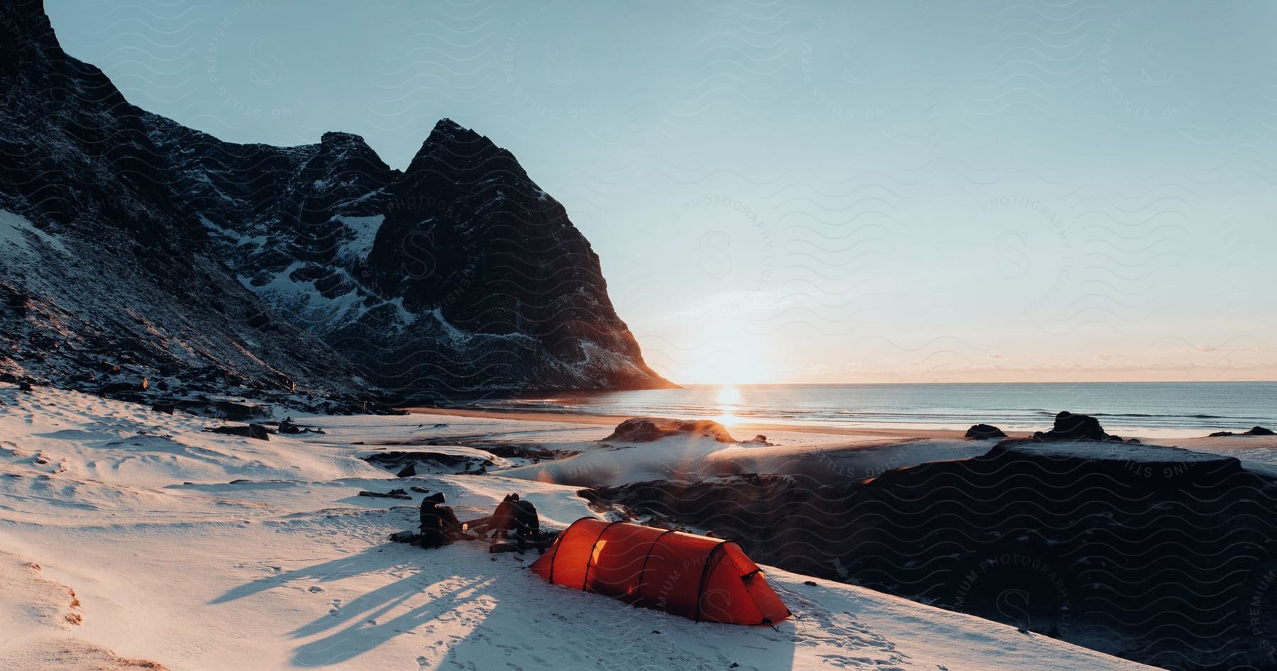 A snowy mountain slope by the sea in norways winter