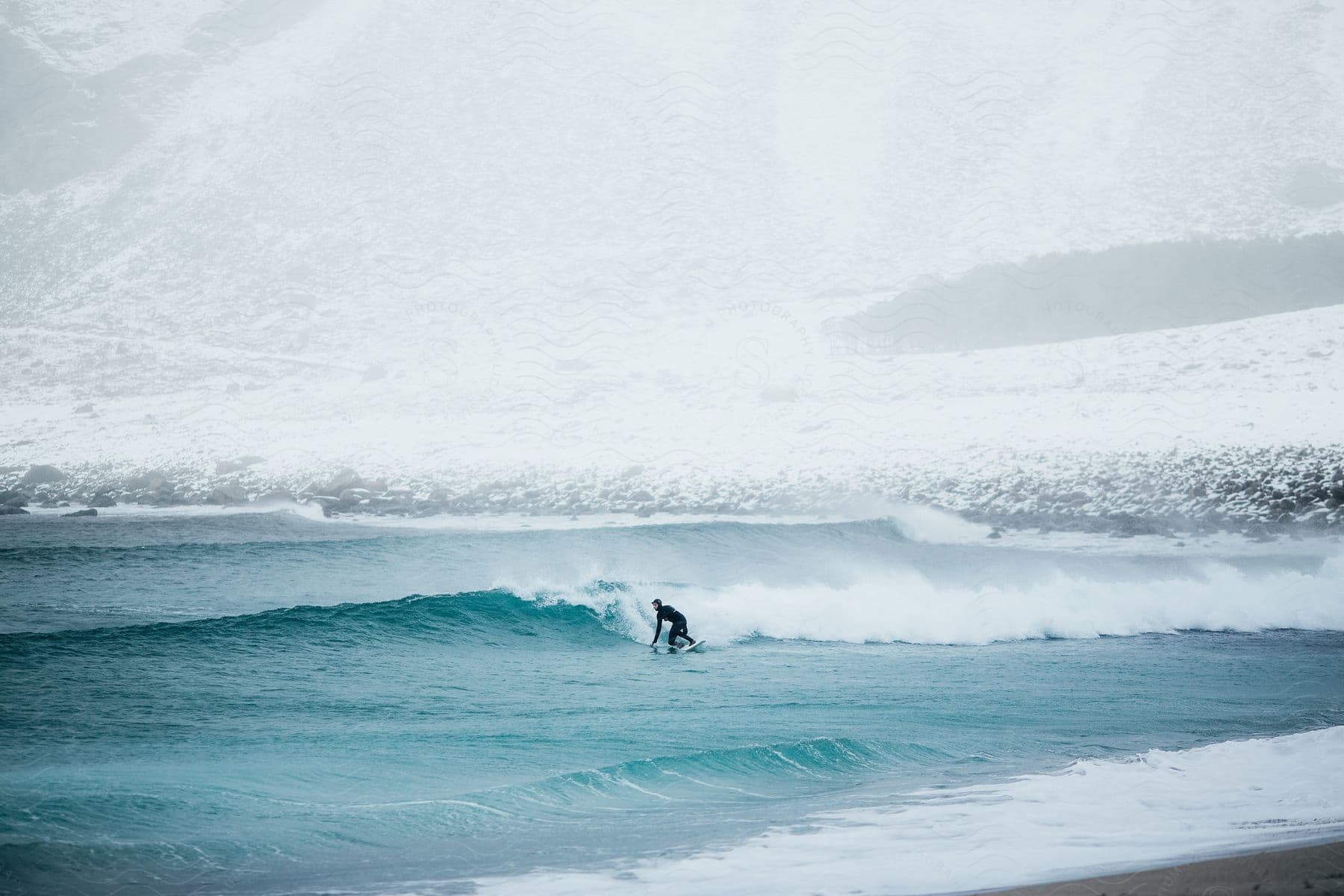 A Persons Silhouette Is Seen Surfing A Wave In The Ocean