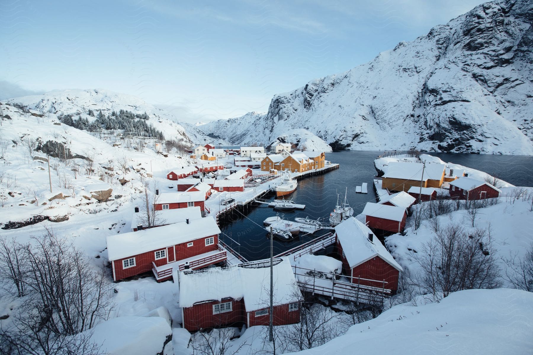 Winter landscape in norway with a calm waterfront and a boat in a rural setting