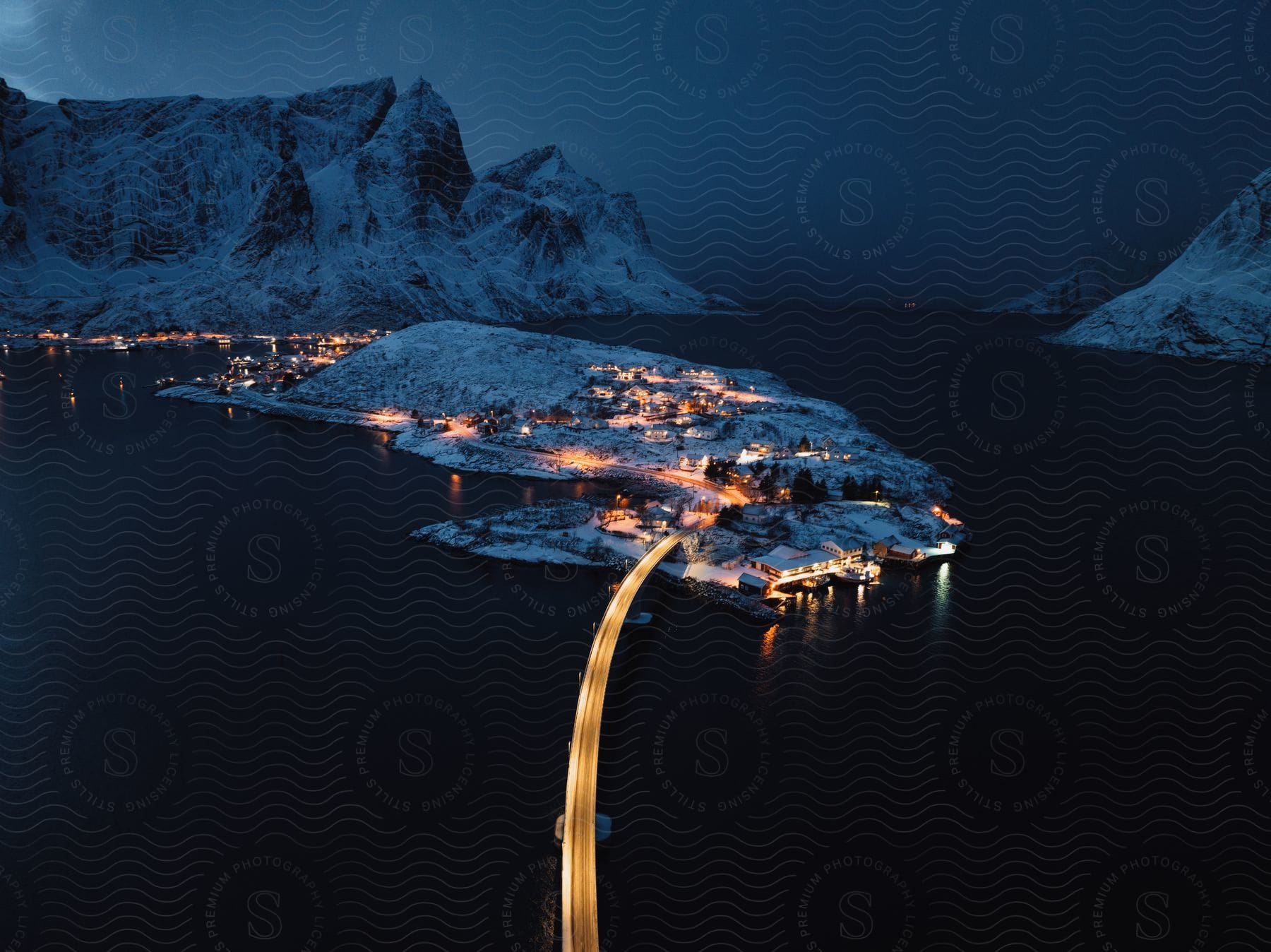 Winter landscape with a lake city and bridge