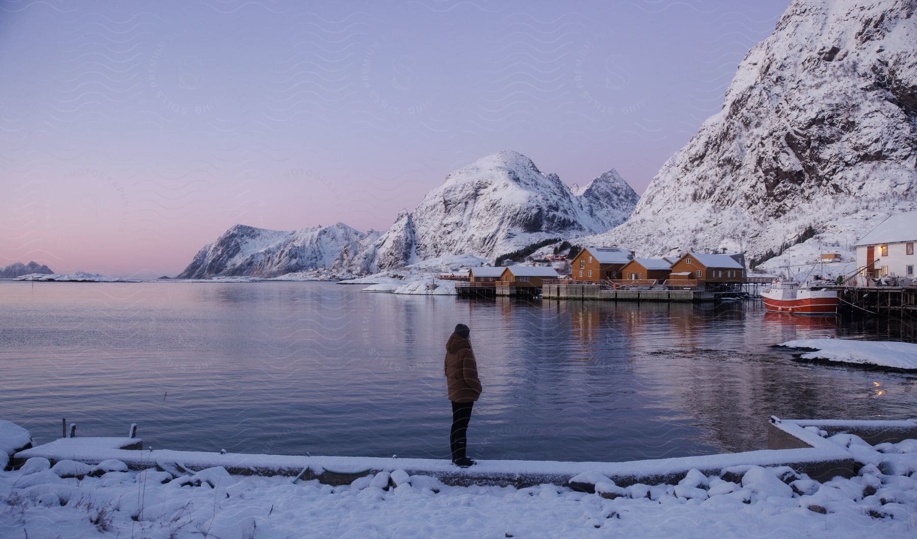 A person standing on the coast during winter season