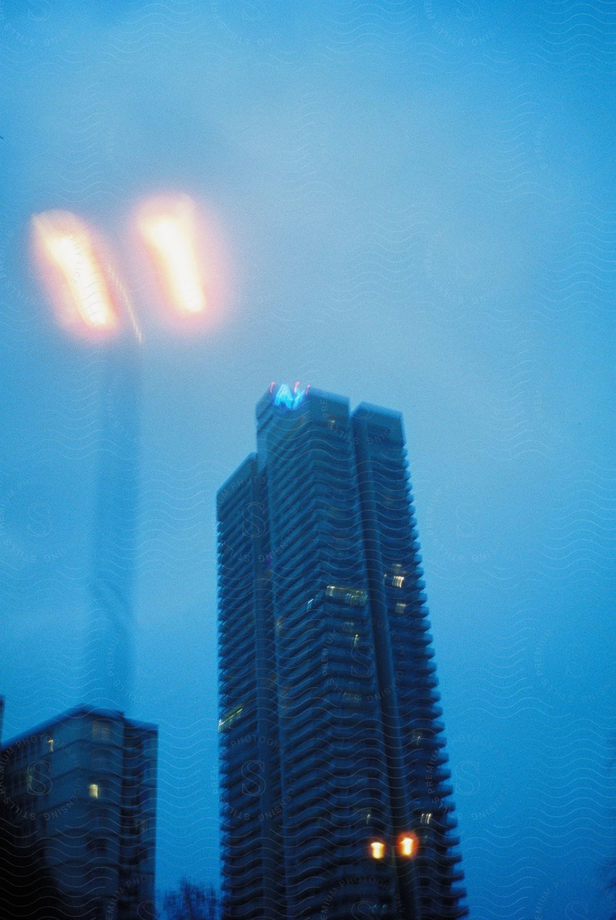 Exterior of coloniahaus skyscraper with cloudy sky