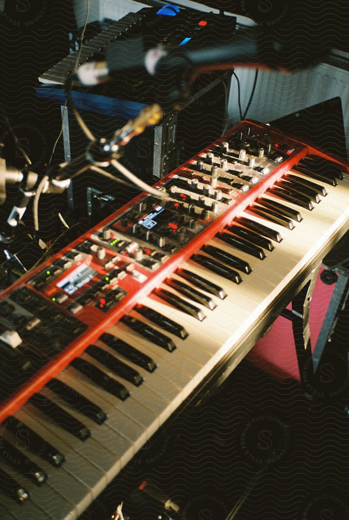 Electric keyboards and microphones are set up in a studio ready for a musician to play some tunes