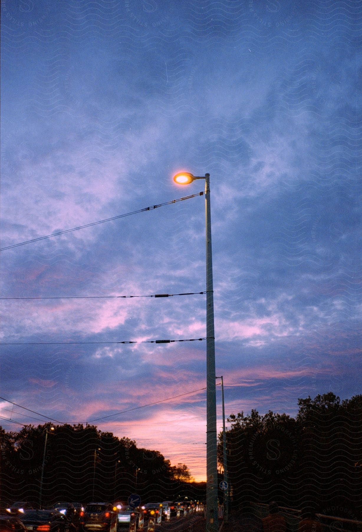 Street landscape with heavy traffic at dusk in an urban setting