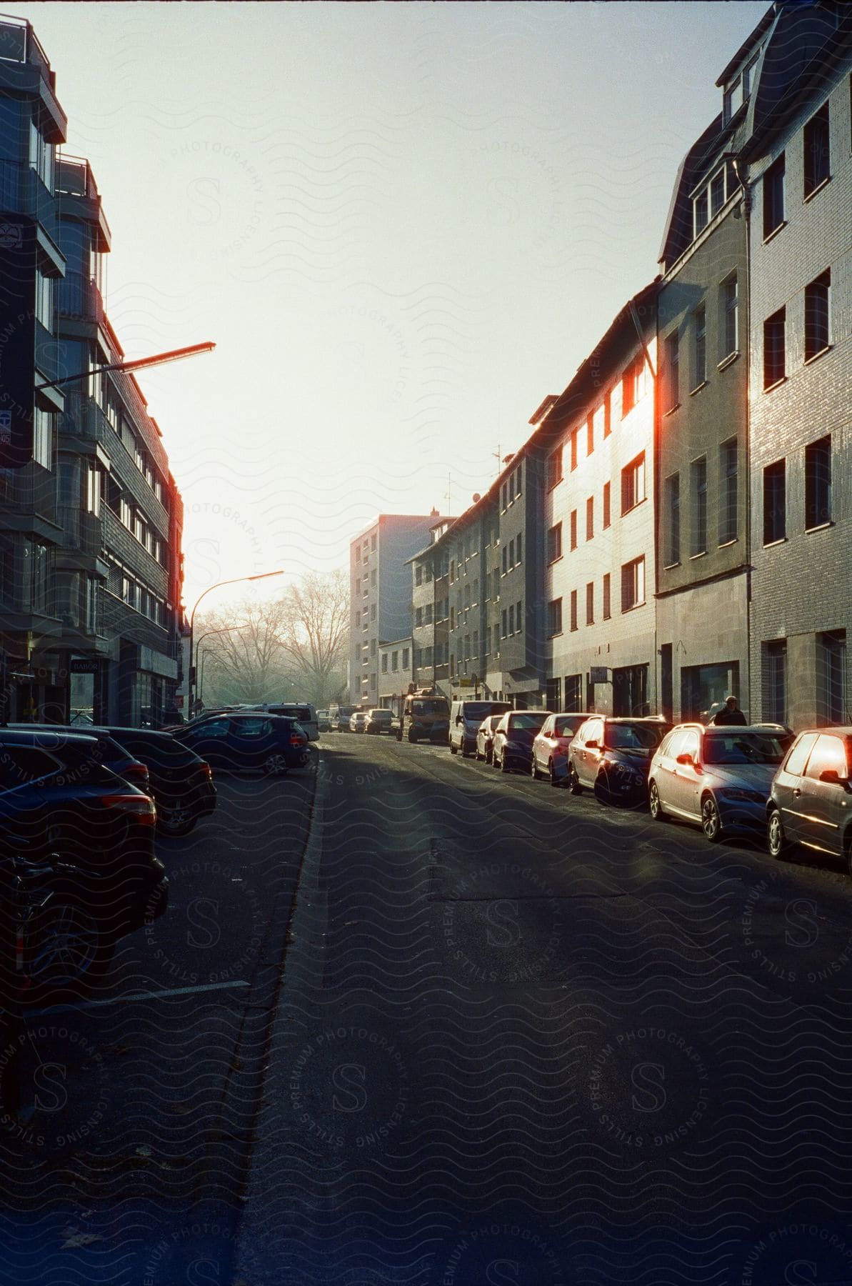 Apartment buildings near a road on a sunny morning in a residential area