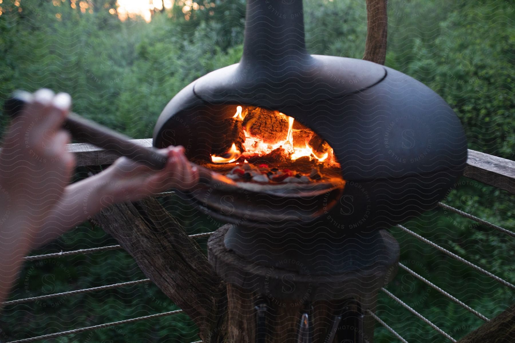 Someone barbecuing outdoors