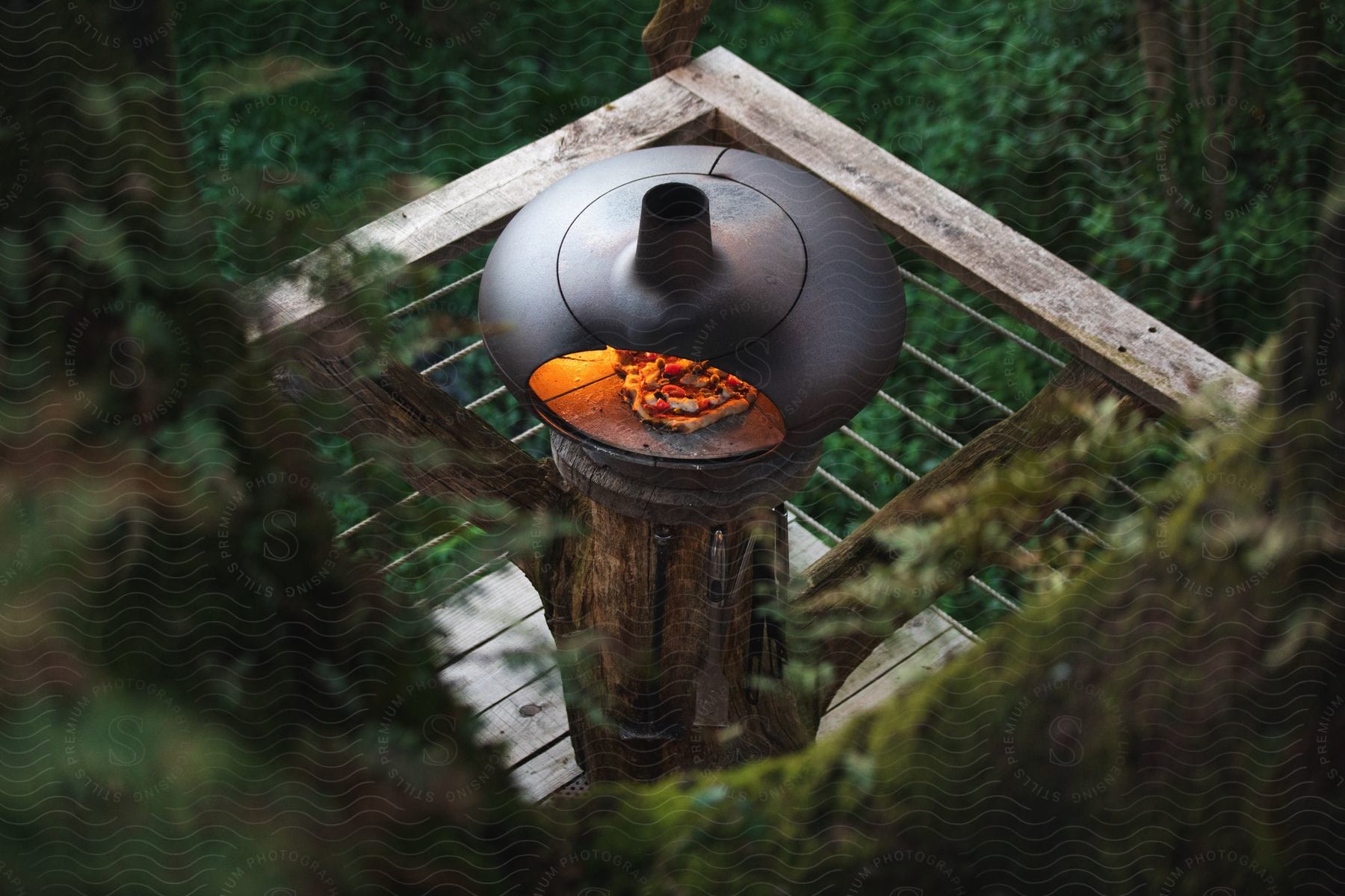 Pizza baking in an outdoor oven