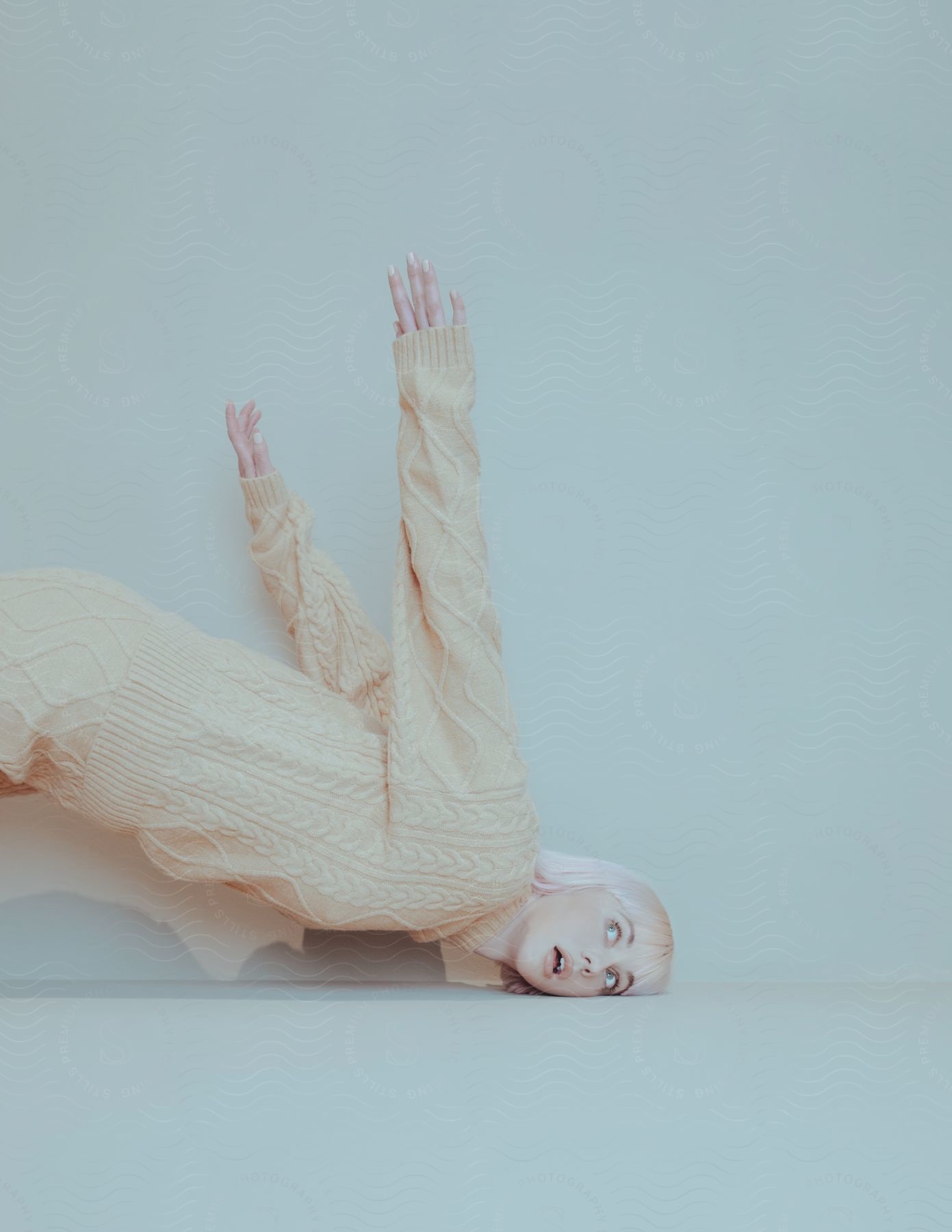 A woman posing on the floor for a portrait